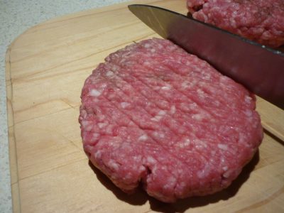 Flatten mince for Danish patties and mark with a knife